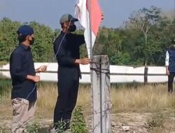 Prihatin Sampah, Massa Ampera dan Warga Gelar Upacara Bendera di Lingkungan TPA Troketon